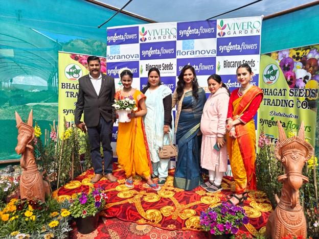 Attending growers take the opportunity to have their picture taken with their family among the beautiful flowers at the Syngenta Flowers Show